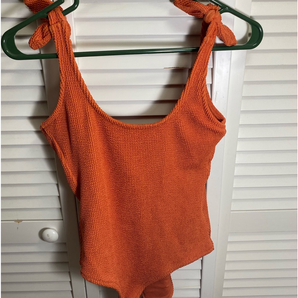 Orange one piece bathing suit from Kona Sol.